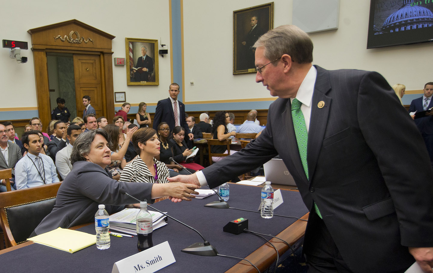 Representative Goodlatte greeting witnesses who appeared at the hearing