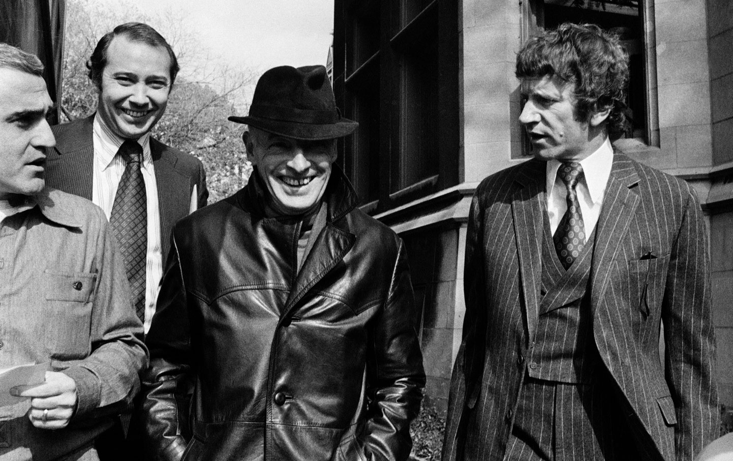 Saul Bellow (middle) after acknowledging his receipt of the Nobel Prize in Literature, October 22, 1976. (Credit: Charles Knoblock / AP)