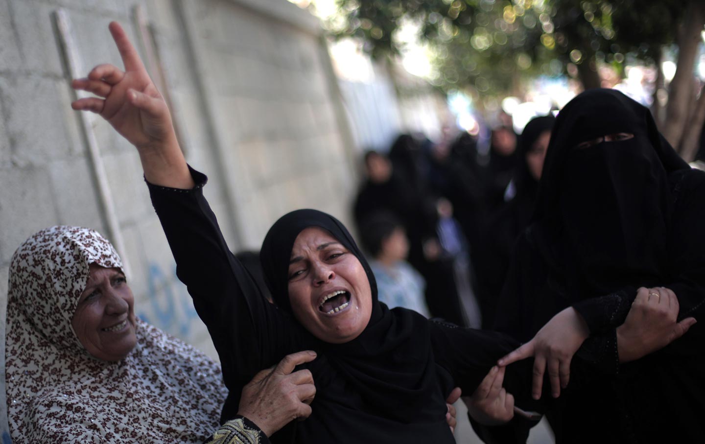 Palestinian women mourn at the funeral of Ahmed Al-Serhi, 27, who was killed during clashes with Israeli troops.