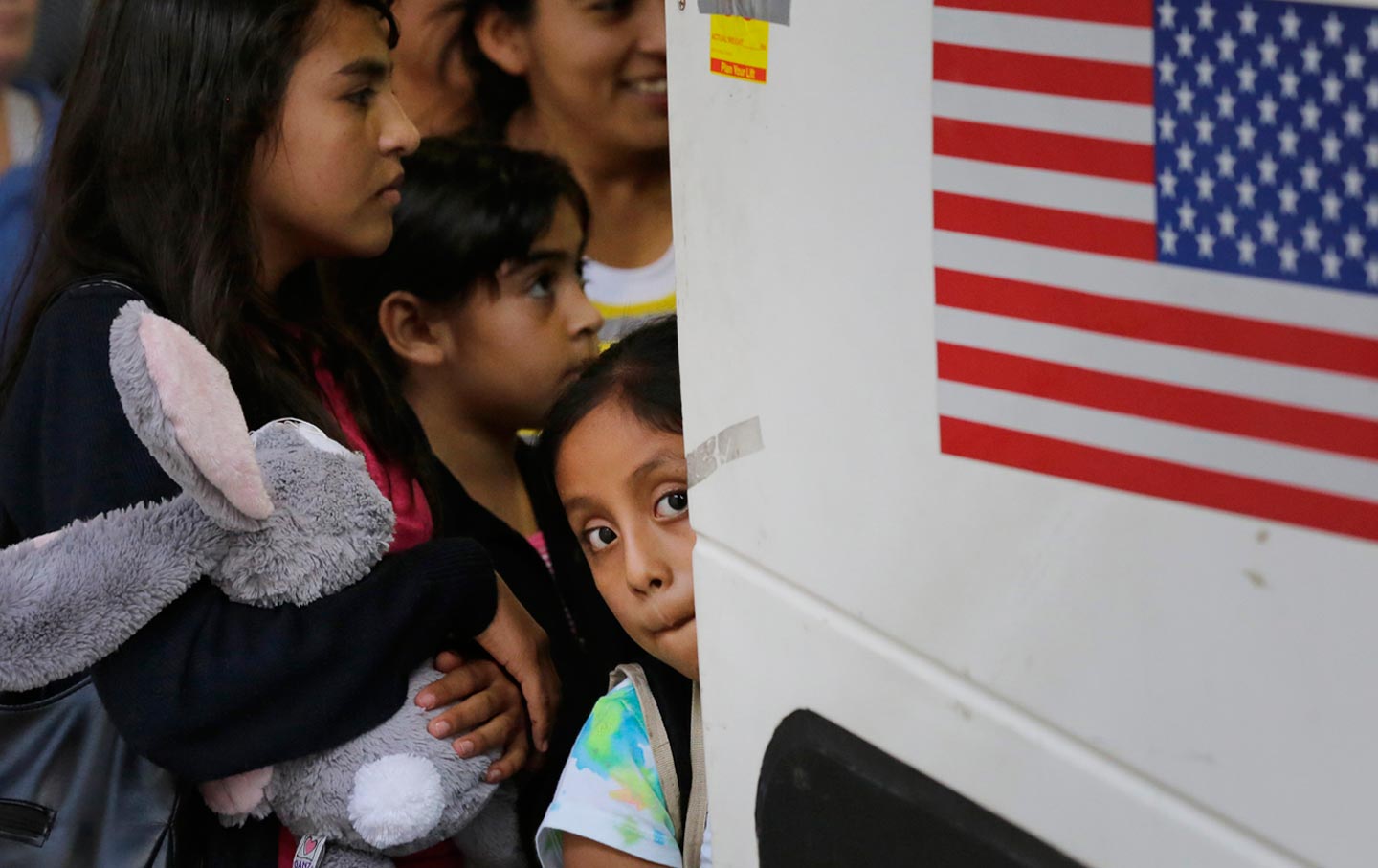 Immigrants from El Salvador and Guatemala board a bus following their release from a family detention center in San Antonio, Texas.