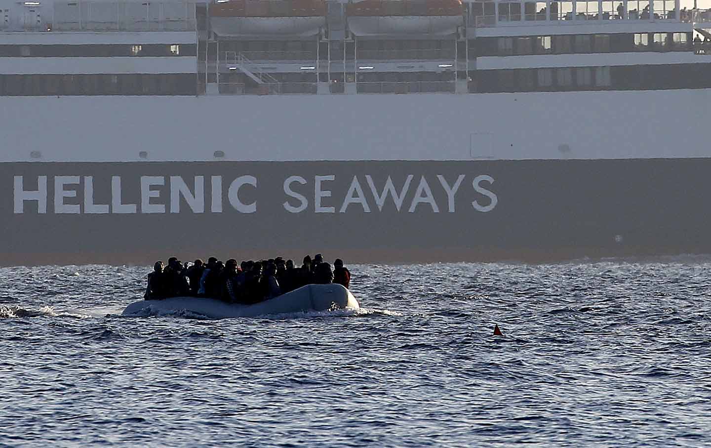 A raft of migrants approaches a beach on the Greek island of Lesbos, November 17, 2015.