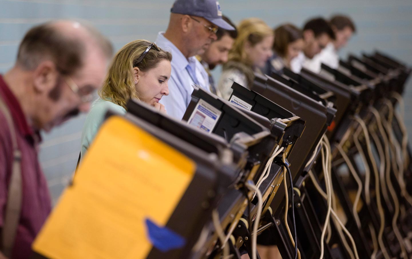 Voters use electronic voting machines on election day, Tuesday, November 3, 2015, in Columbus, Ohio.