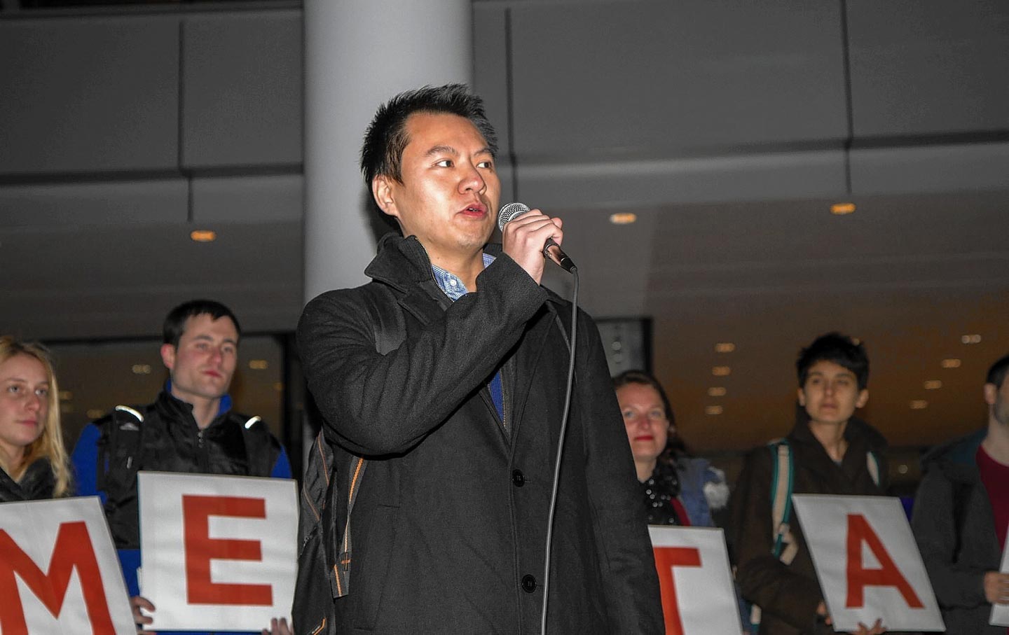 Graduate workers and supporters rally around Grant Mao at Yale University, December 8, 2015.