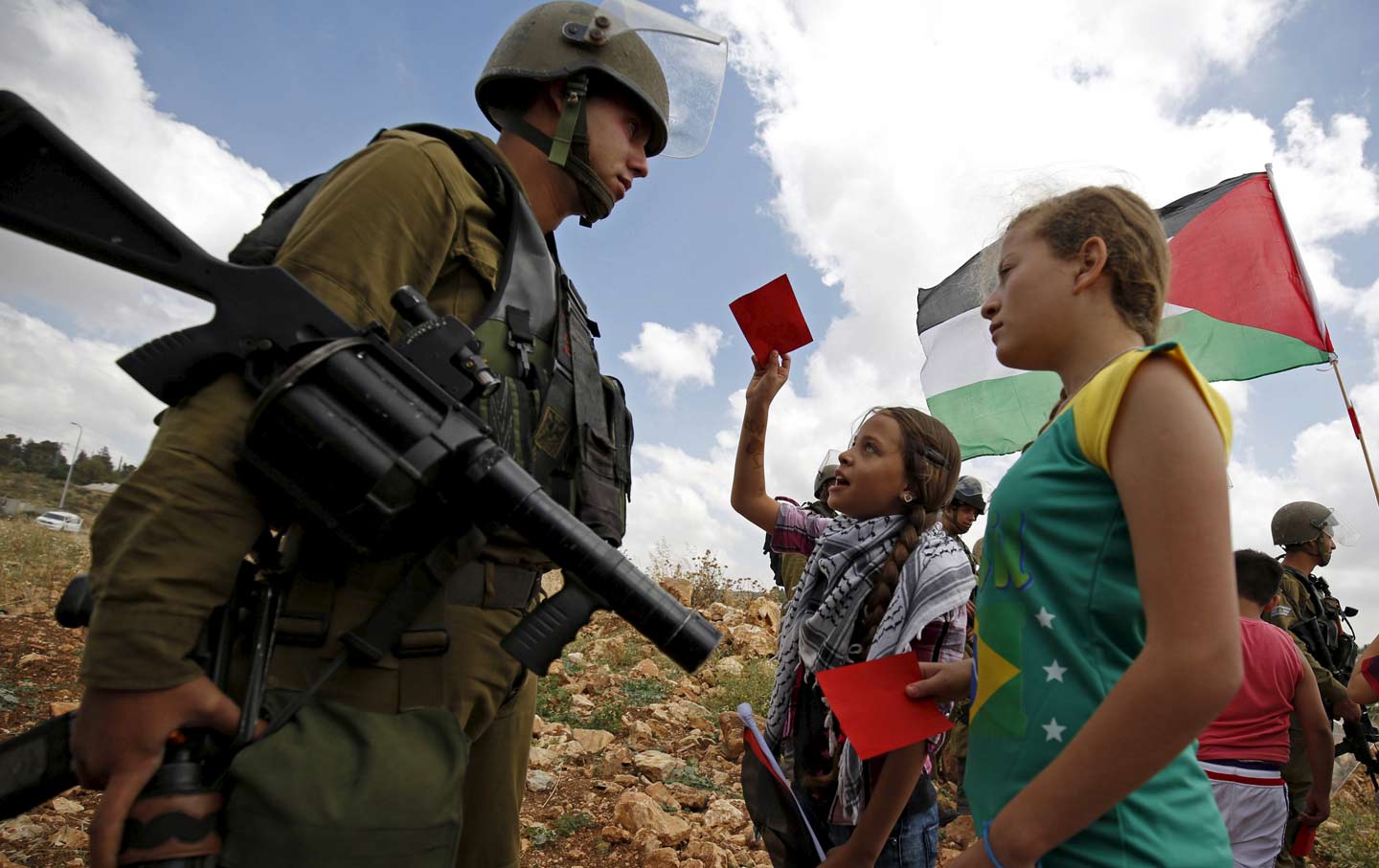 Girls and Soldier Conflict Over Soccer