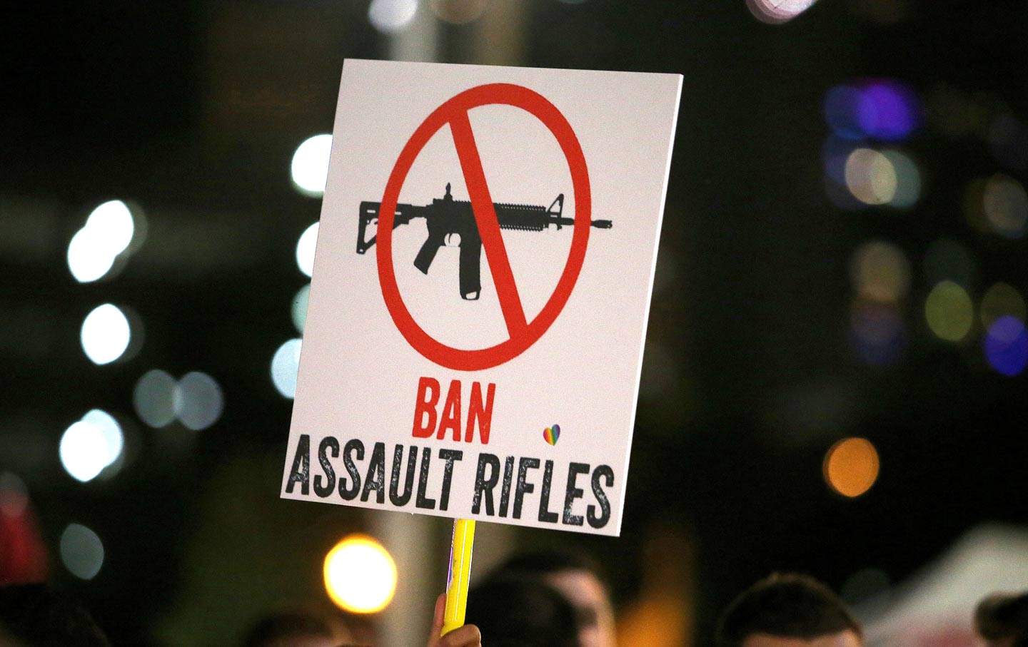 A sign calling to ban assault rifles