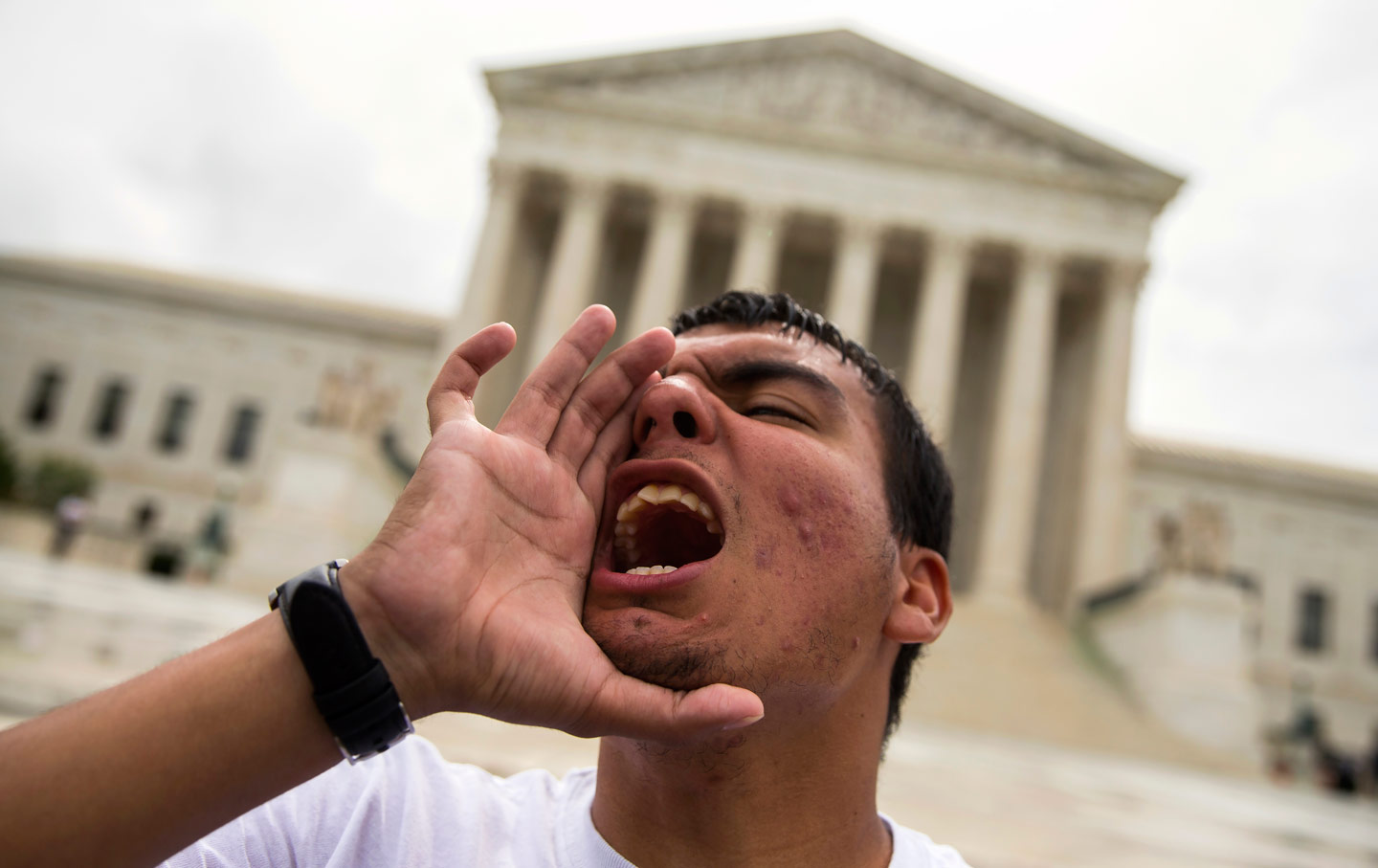 A young man yells during a demonstration at the Supreme Court