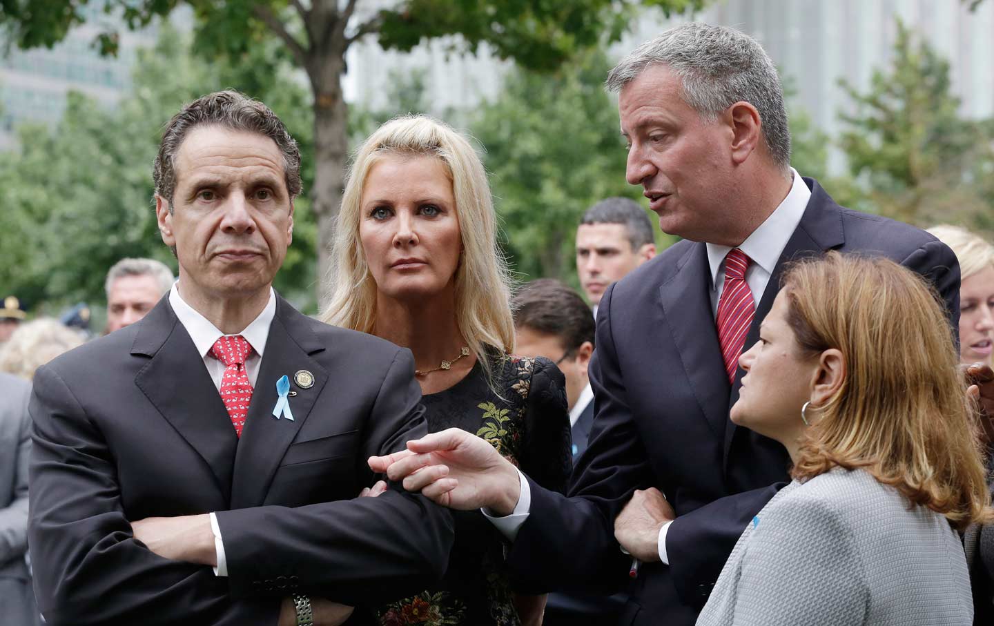 Cuomo looking angry, de Blasio trying to talk to him