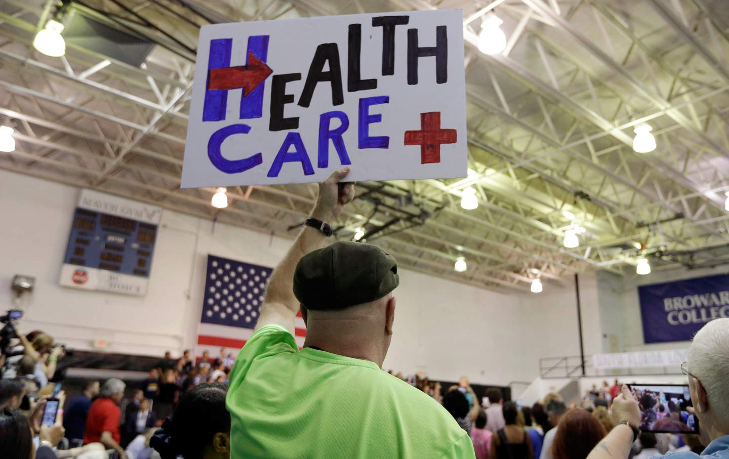 Clinton supporter holds up healthcare sign