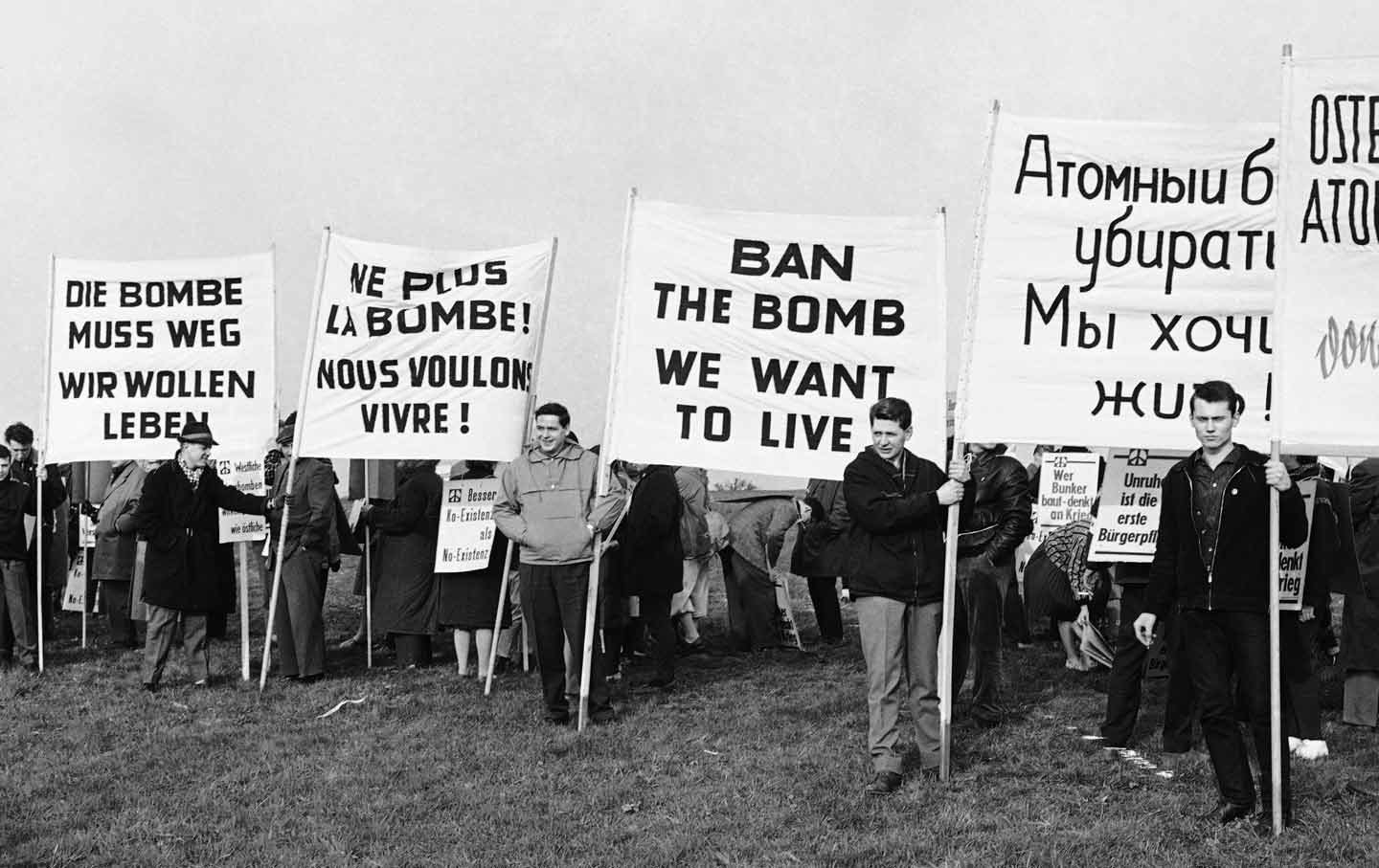  Demonstrators displaying signs in German, French, English, and Russian near a future rocket range in Bavaria, Germany, 1961. (AP Photo / Lindlar)