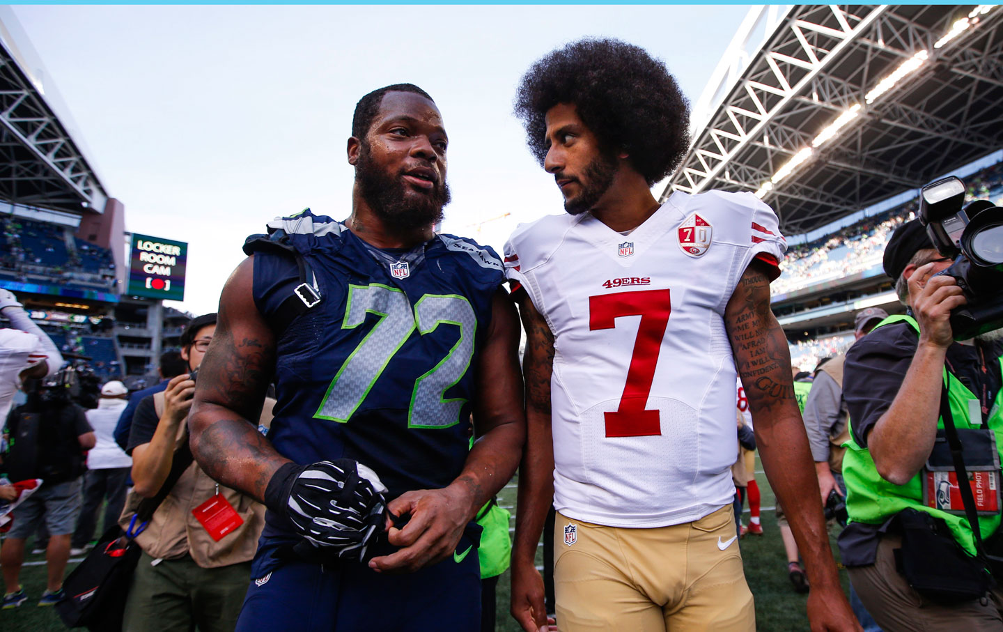 Seattle Seahawks defensive end Michael Bennett and San Francisco 49ers quar...