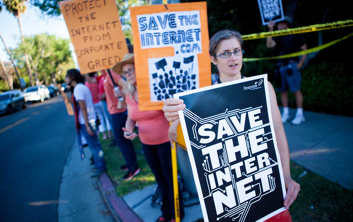 Free Press activists rally for net neutrality.