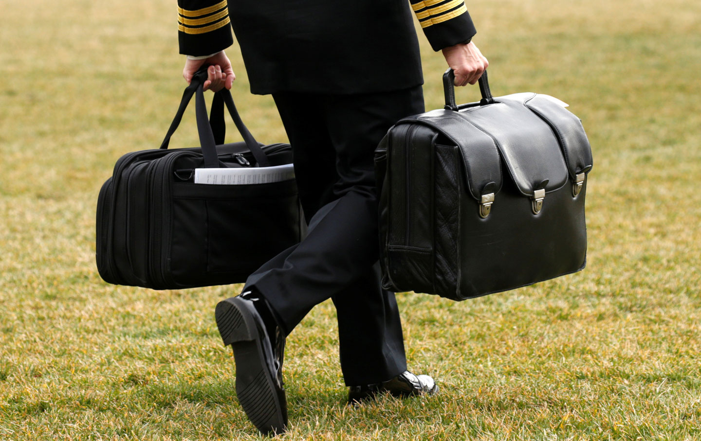A military aide, carrying the 