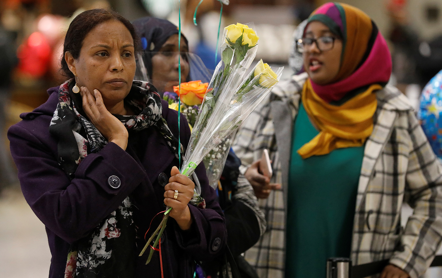 Families waiting to greet relatives coming from Somalia