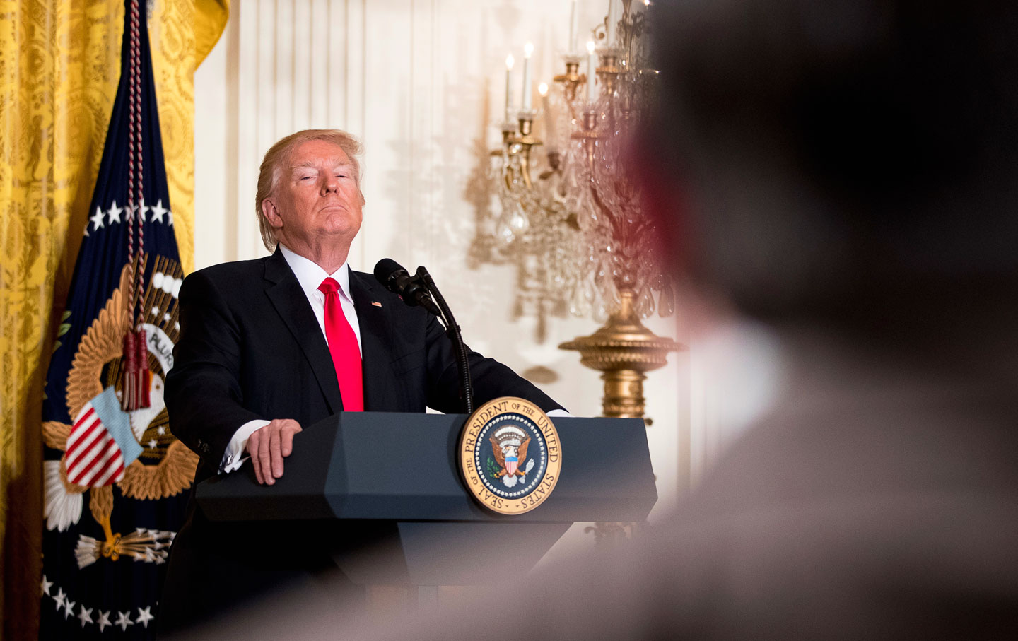 Donald Trump takes a question during a news conference