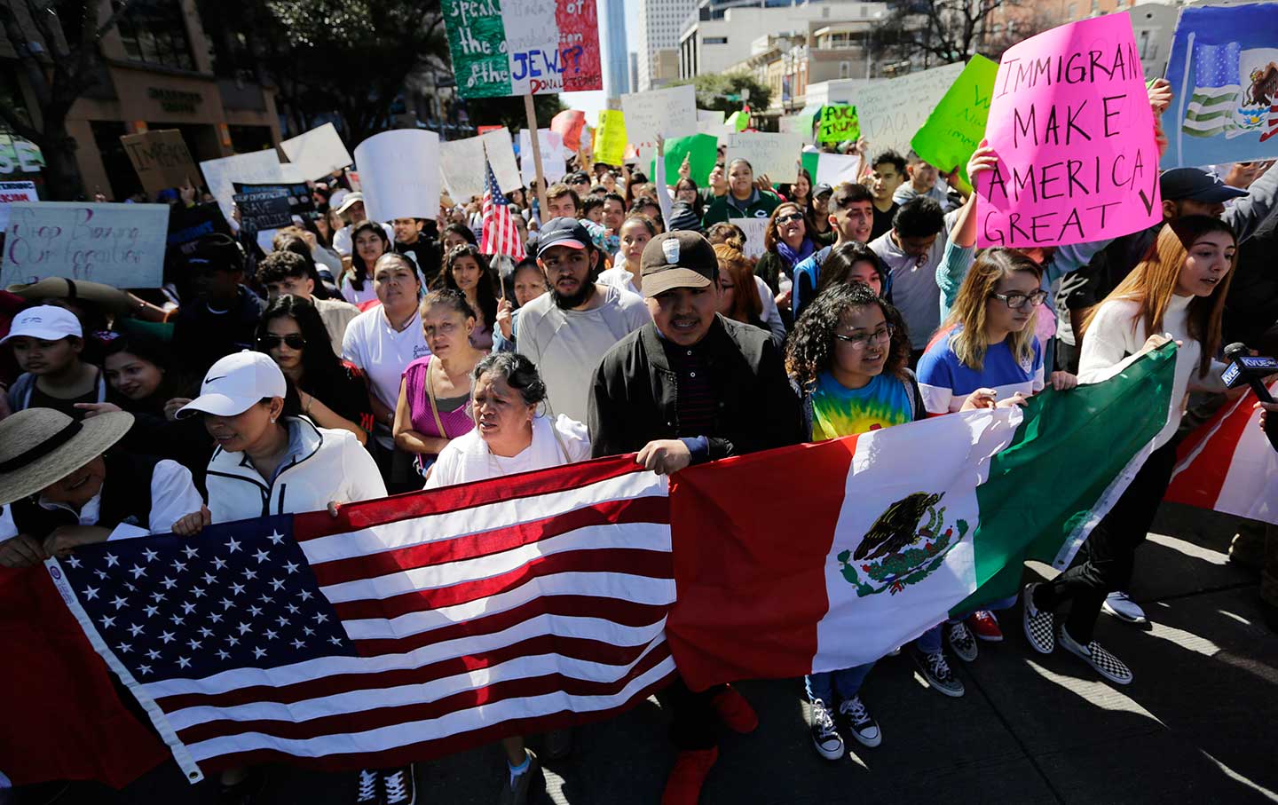 A group marches through downtown Austin heading to the Texas Capitol during an immigration protest, Thursday, Feb. 16, 2017.