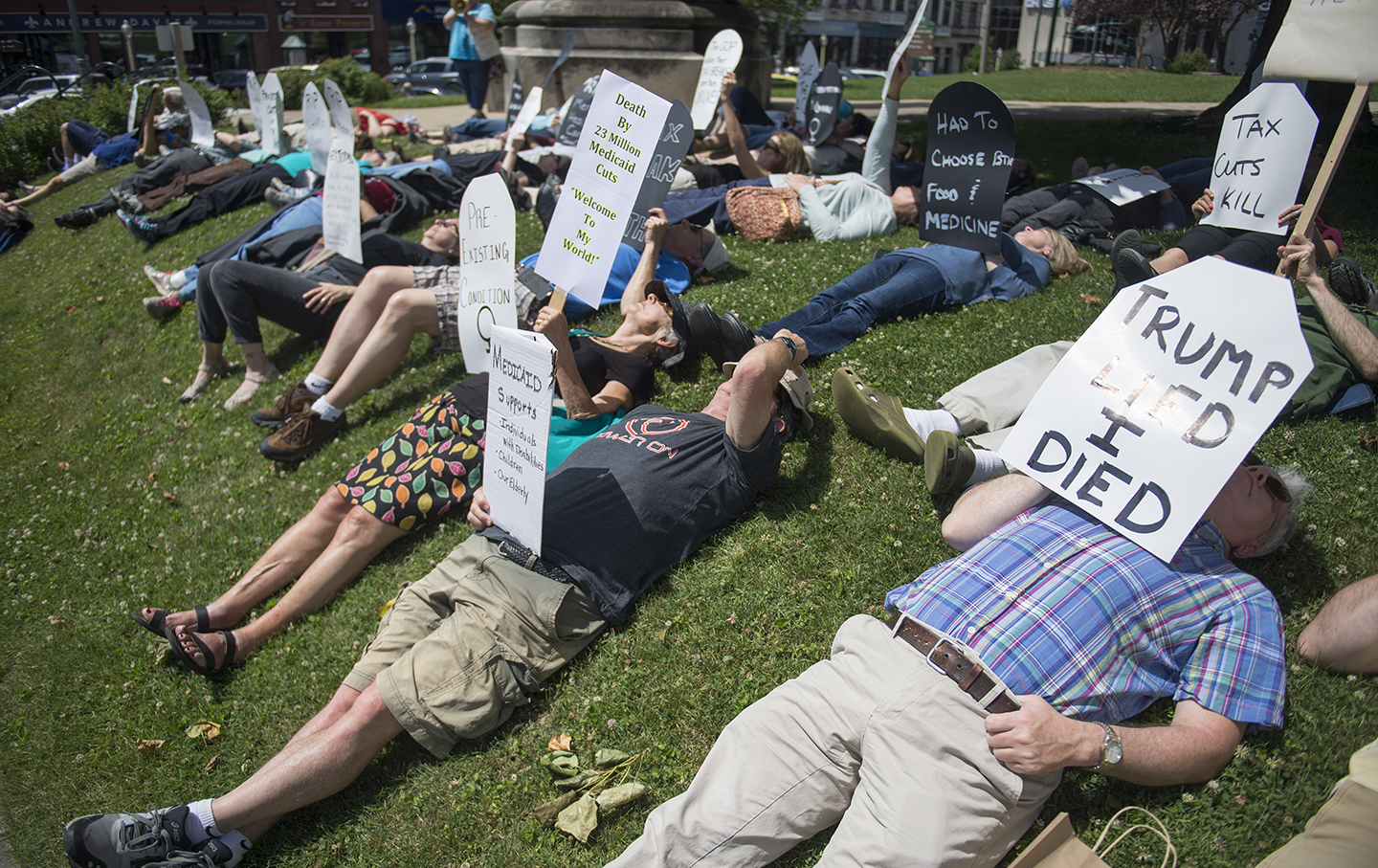 Local concerned citizens gather to protest the current health care bill being considered in the Senate with a 