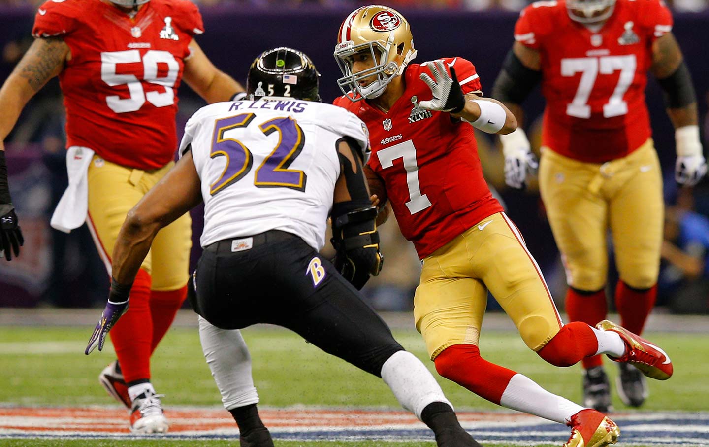 Ray Lewis (52) chases San Francisco 49ers quarterback Colin Kaepernick (7) during the NFL Super Bowl XLVII game on February 3, 2013.