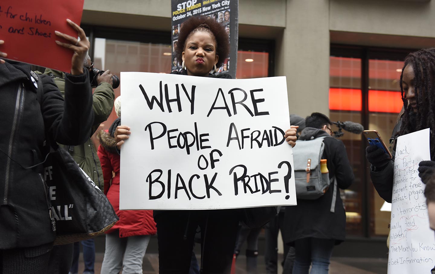 A Black Lives Matter supporter holds a sign in front of the NFL headquarters as part of a demonstration on February 16, 2016.