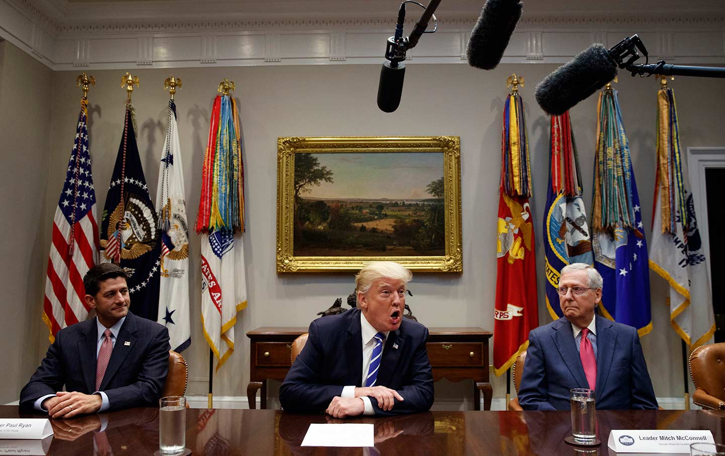 House Speaker Paul Ryan, left, and Senate Majority Leader Mitch McConnell, right, listen as Donald Trump speaks during a meeting on tax reform in the White House on September 5, 2017.