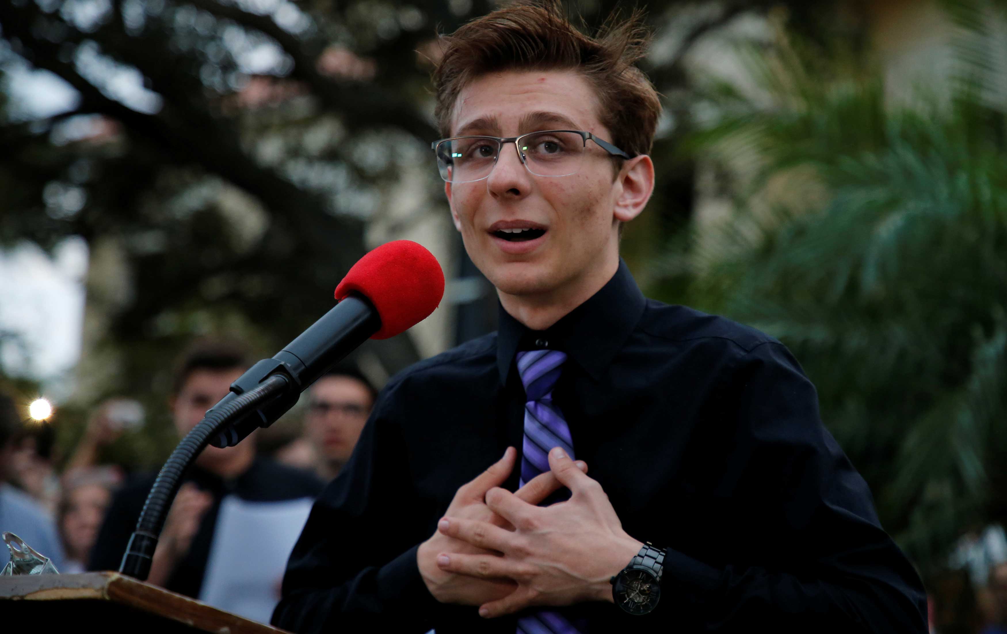 Dylan Baierlein, a student at Marjory Stoneman Douglas High, speaks to protesters at a Call To Action Against Gun Violence rally by the Interfaith League and others in Delray Beach, Florida.