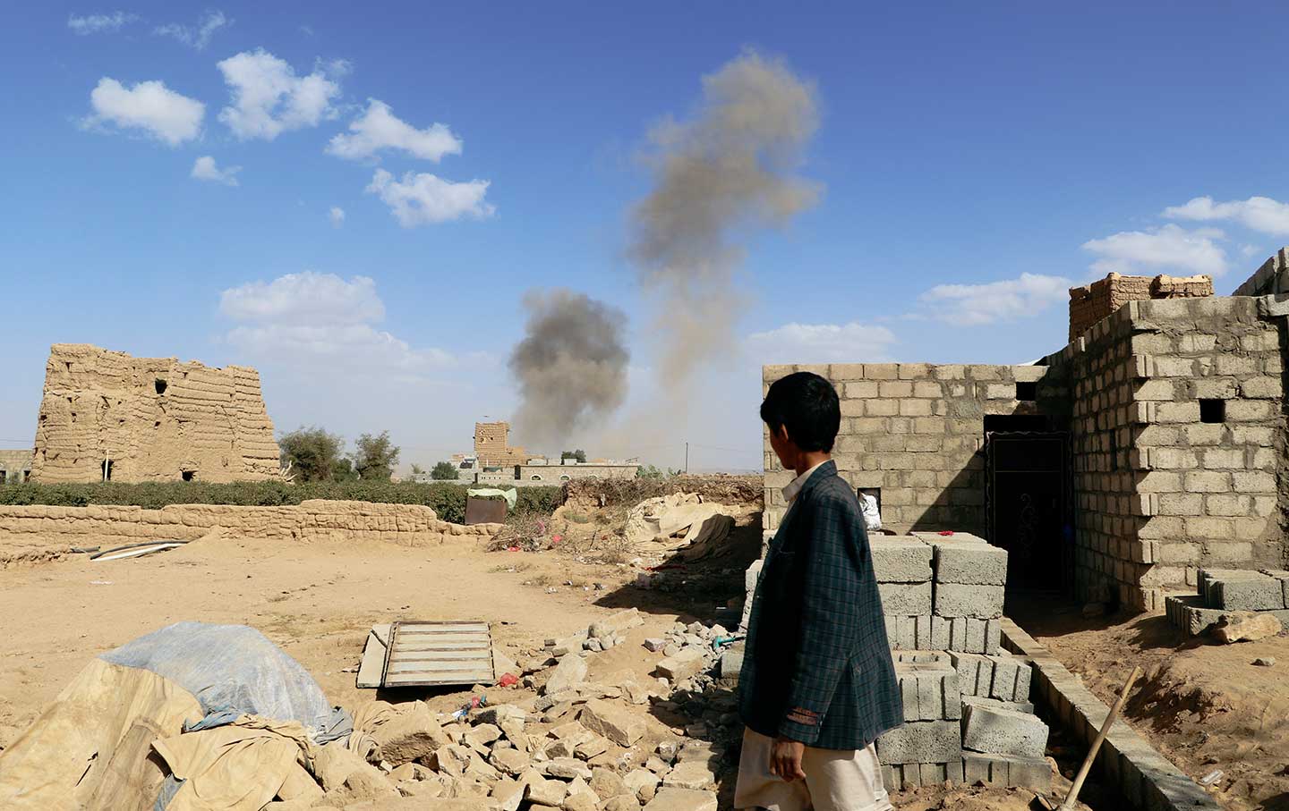 Boy watches airstrike Yemen