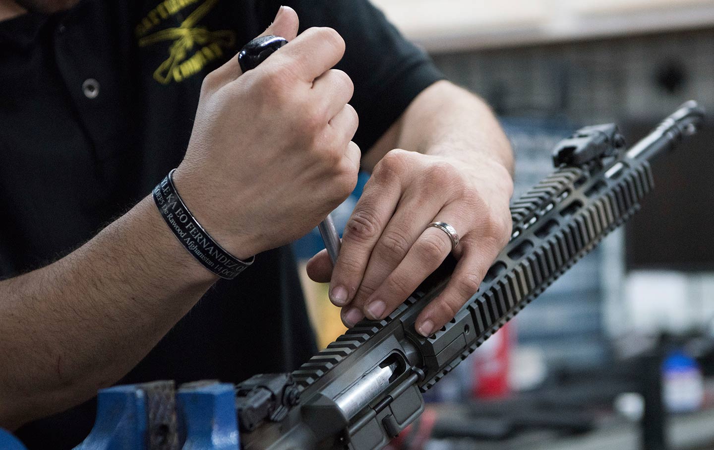 Man installing gun parts