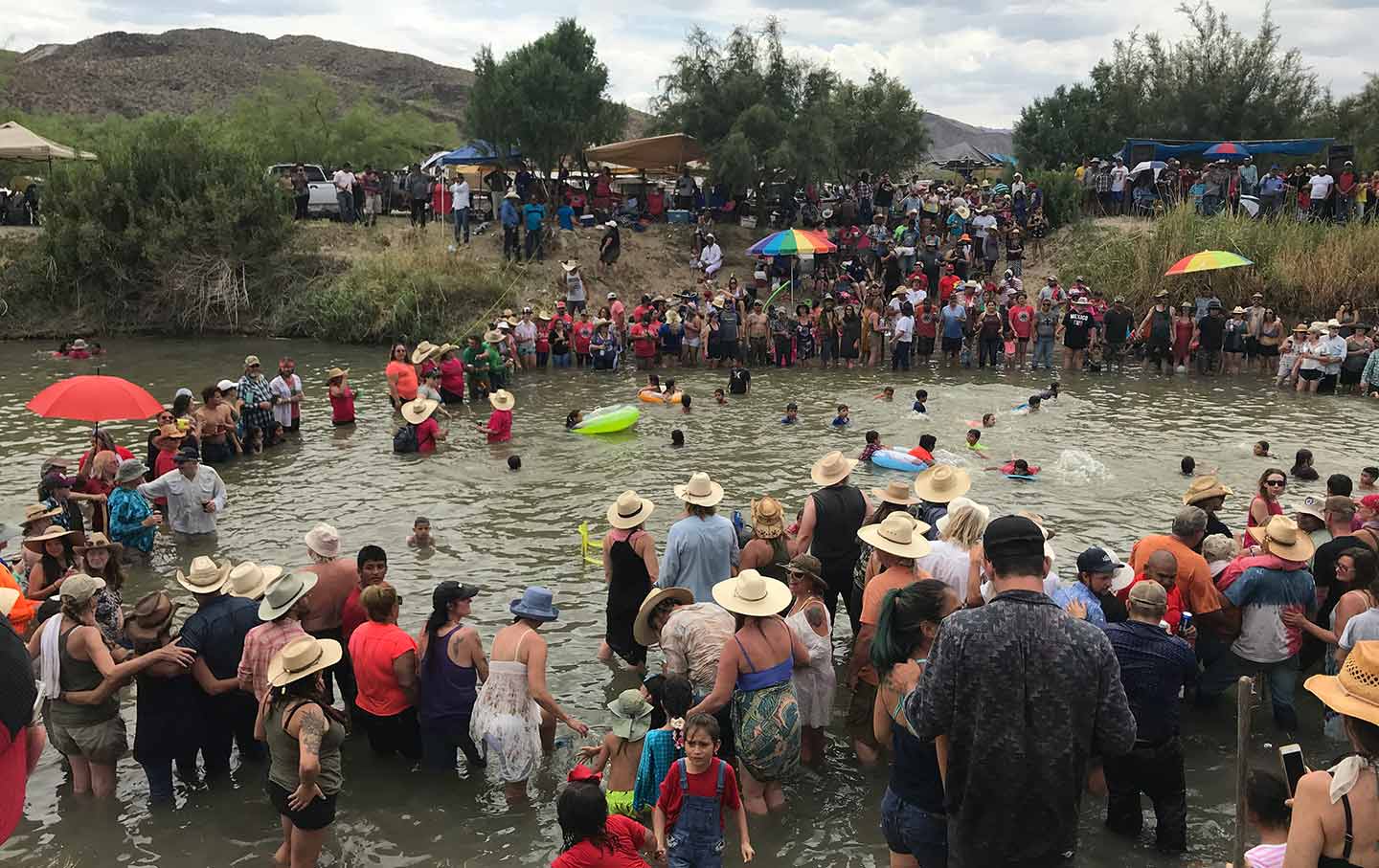 People gather to celebrate at the Rio Grande