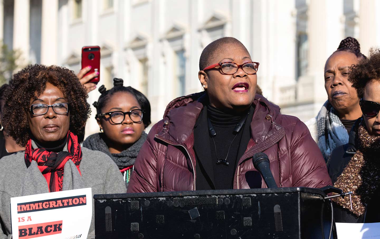 Melanie Campbell speaks at podium