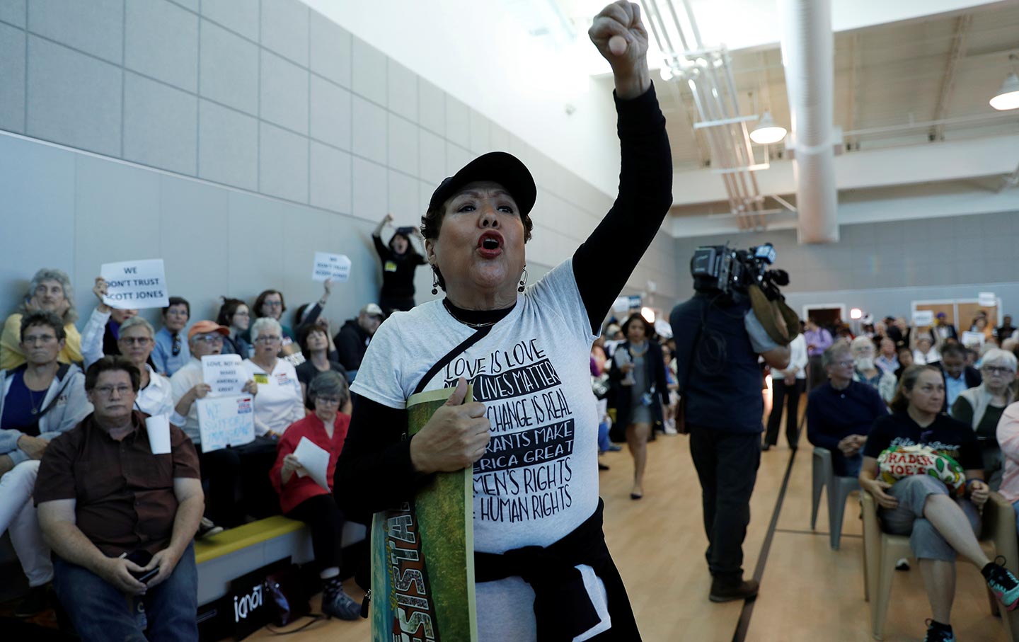 Woman protests Thomas Homan