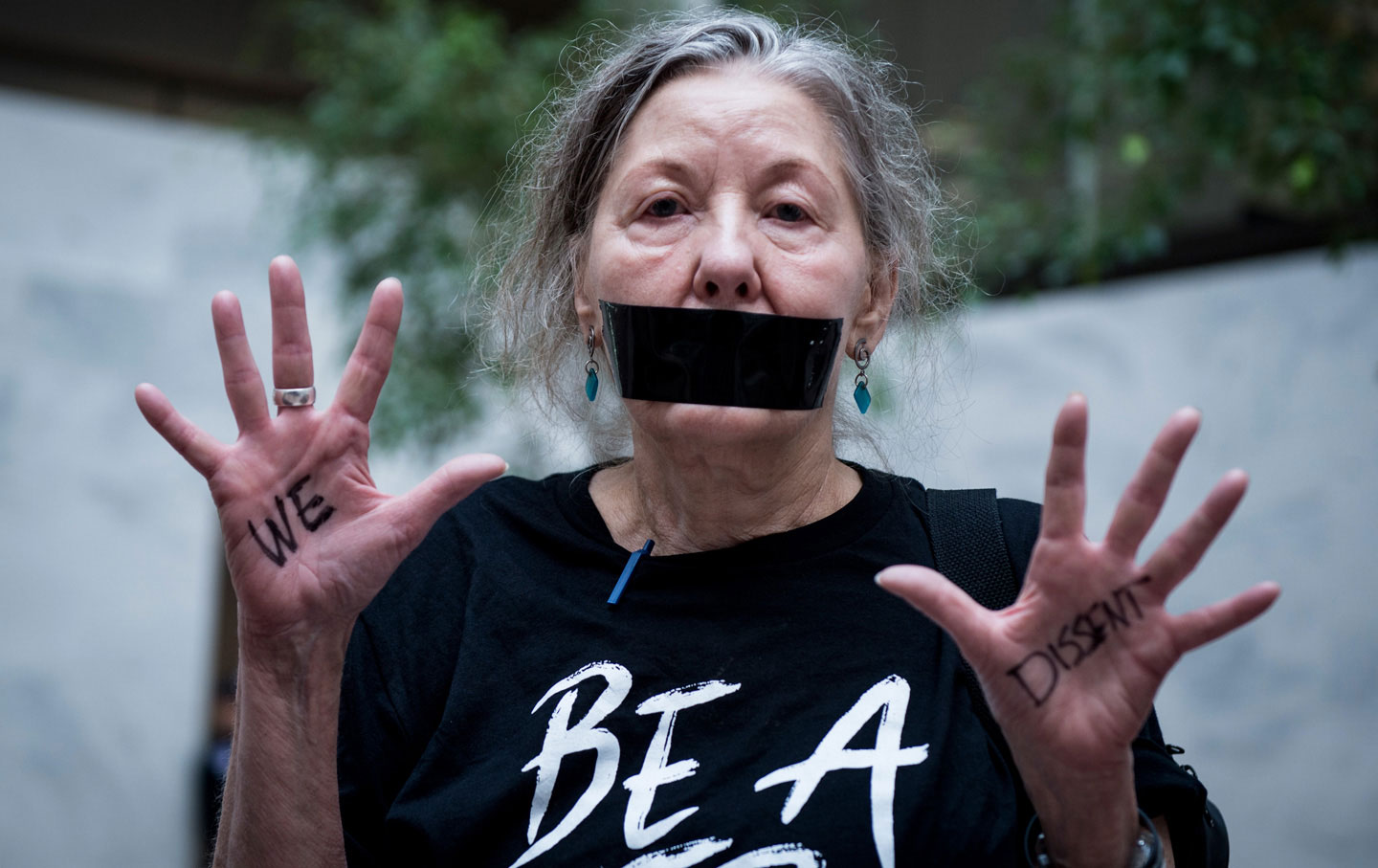 A group of women are seen wearing black veils and black tape over their mouths outside of the fourth day of Brett Kavanaugh's hearing before members of the Senate Judiciary Committee in the Hart Senate Office Building Friday.