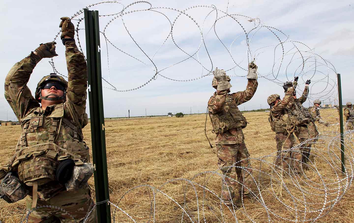 border troops string barbed wire