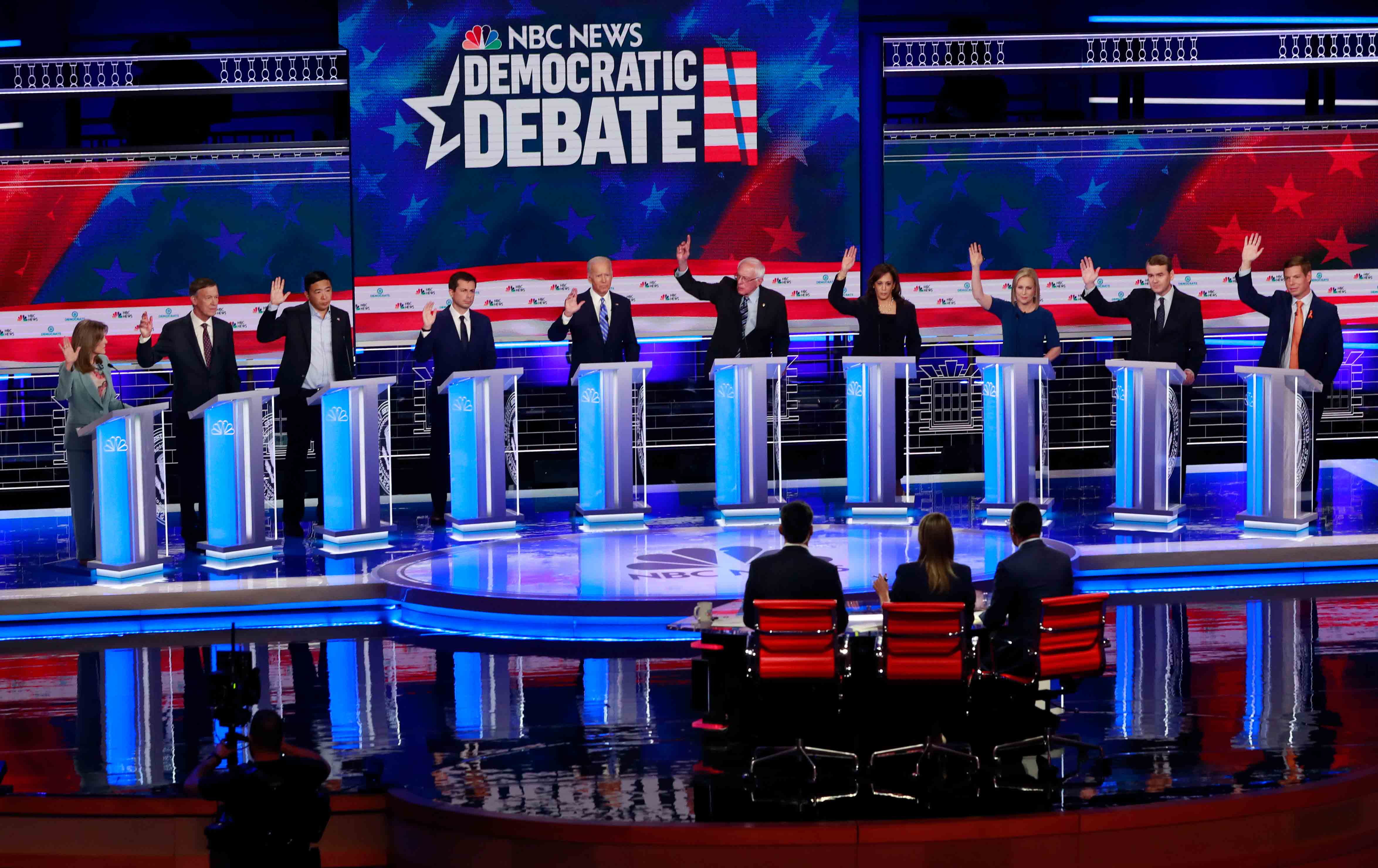 Democratic presidential candidates raise their hands