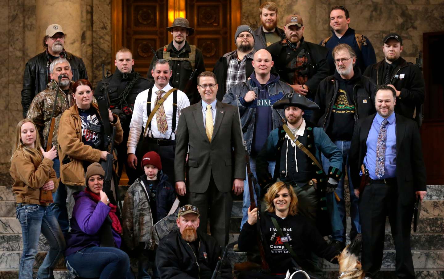 Matt Shea poses with gun-rights activists in a group photo