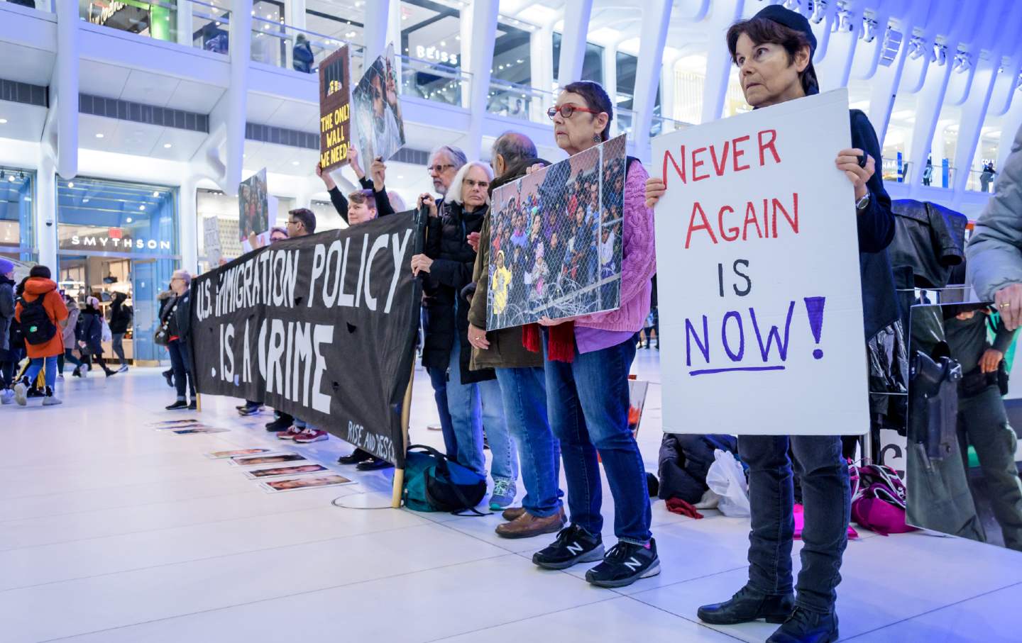 Members of the activist group Rise And Resist gather in silent protest