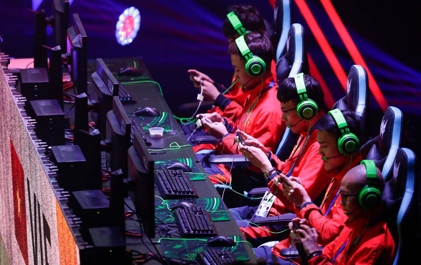 A row of gamers concentrating during an esports competition.