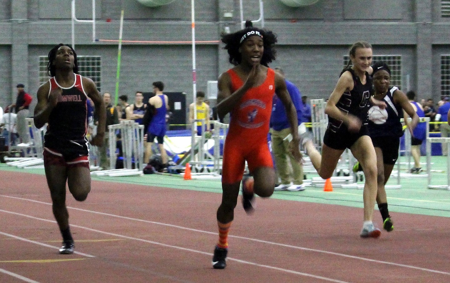 Bloomfield High School athletes Terry Miller, second from left, and Andraya Yearwood, far left, compete in the 55-meter dash at the Connecticut girls Class S indoor track meet in New Haven, Connecticut, February 2019.