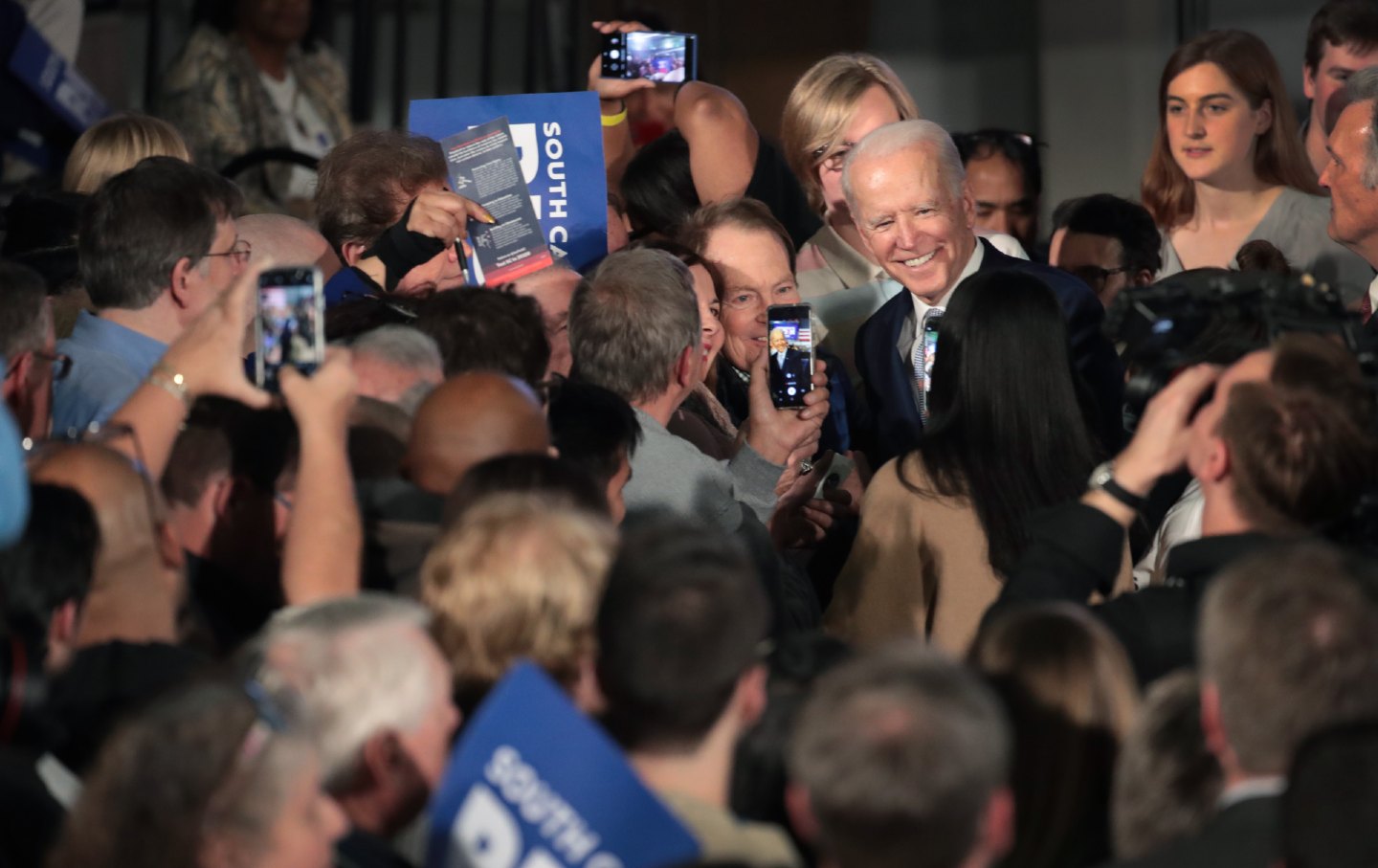 Joe Biden takes pictures with supporters