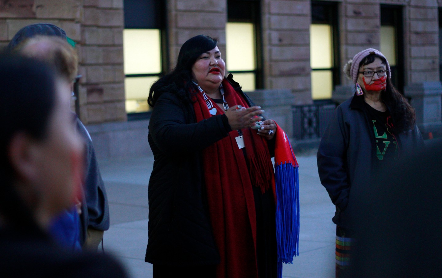 Candi Brings Plenty prays outside SD capitol