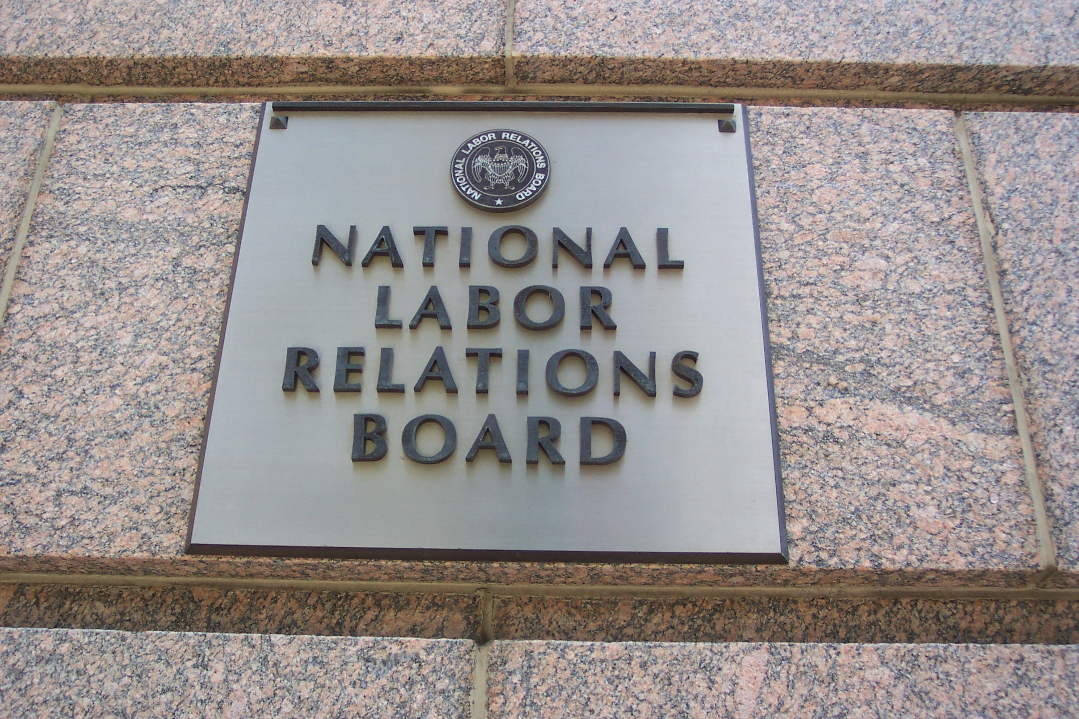 A sign on a building reads: National Labor Relations Board