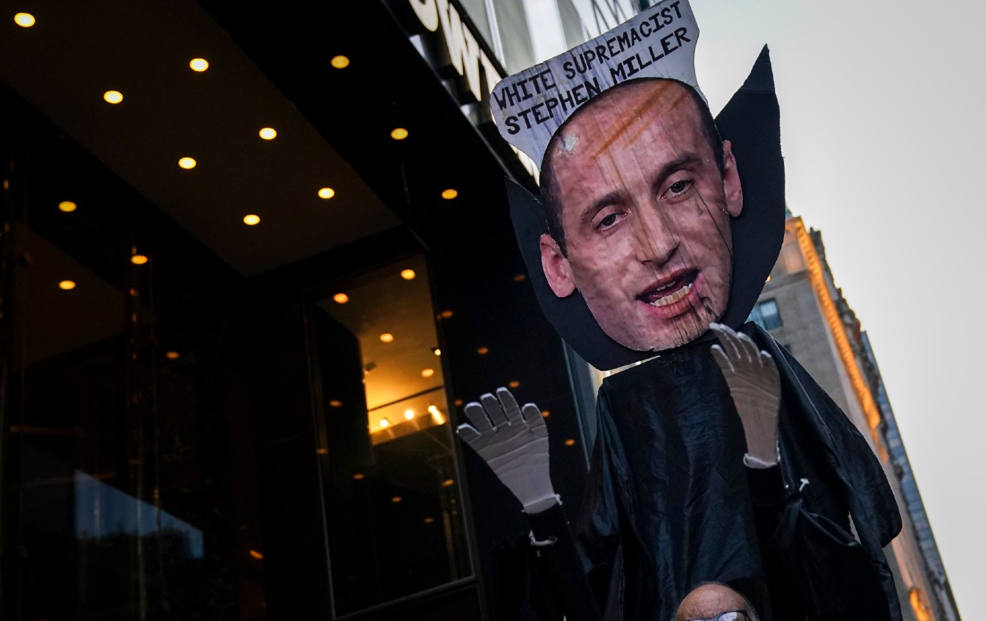 A large effigy of Stephen Miller that reads 