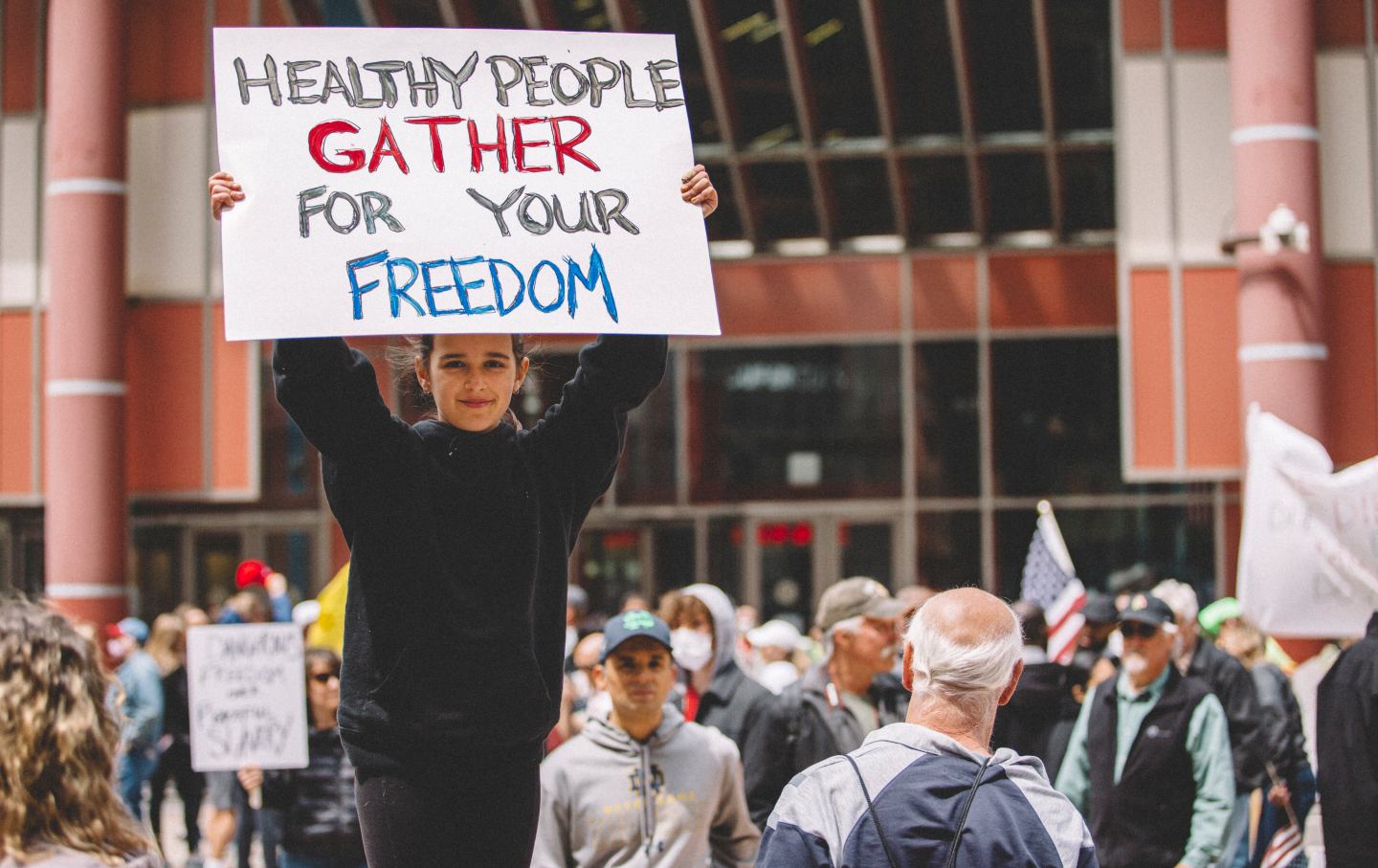 A child holding a protest sign