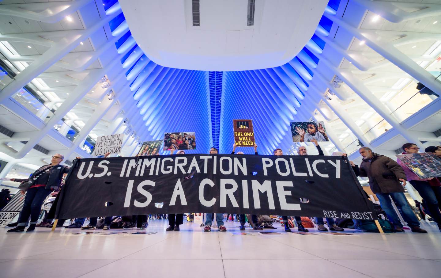 Activists hold a banner that reads 