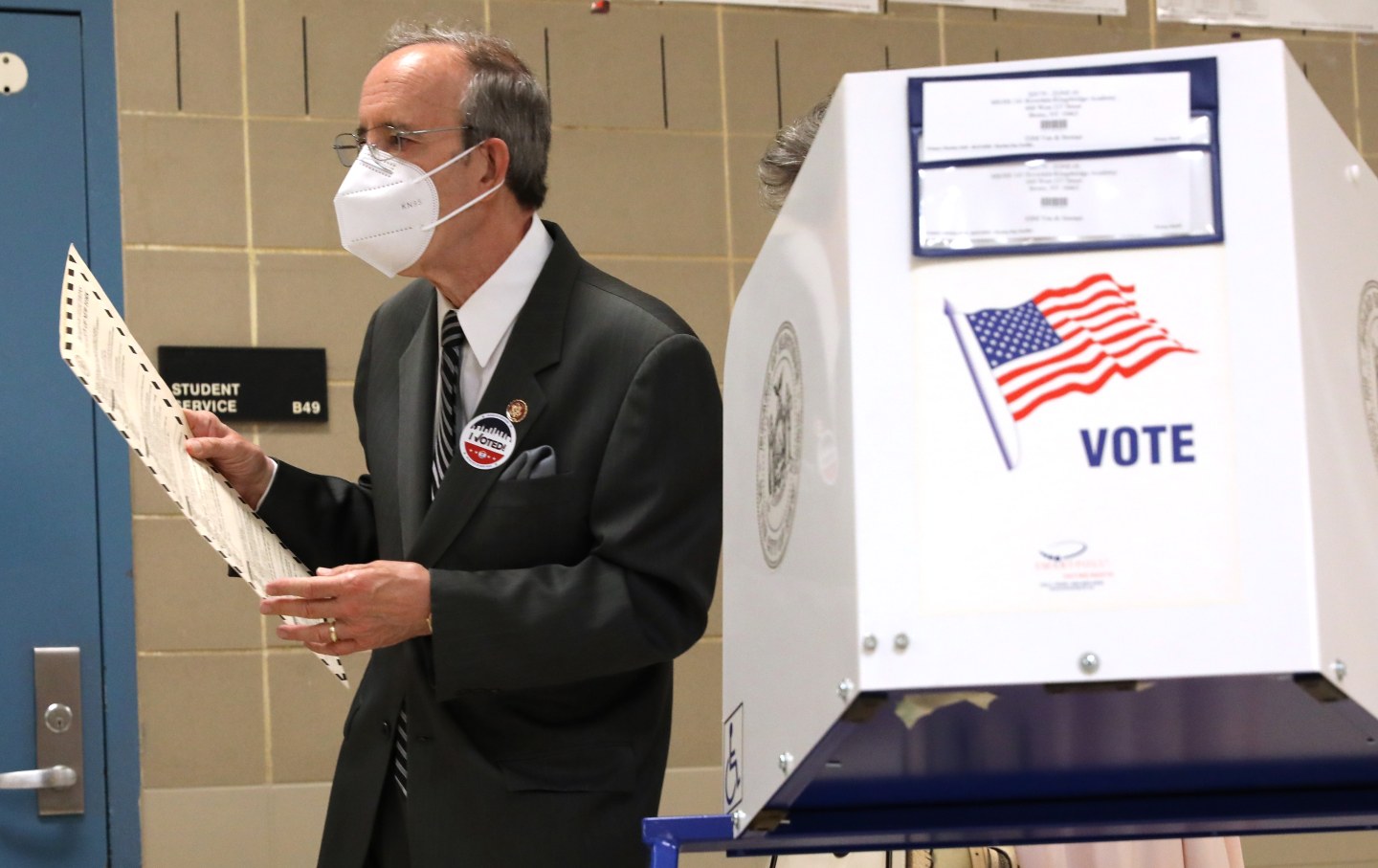 Eliot Engel walks past a voting booth