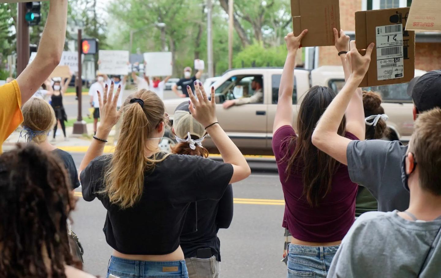 Protesters holding up their hands