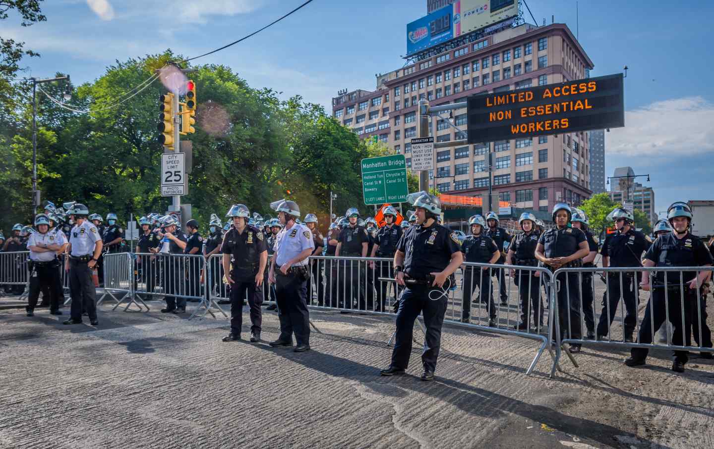 NYPD officers line bridge in riot gear