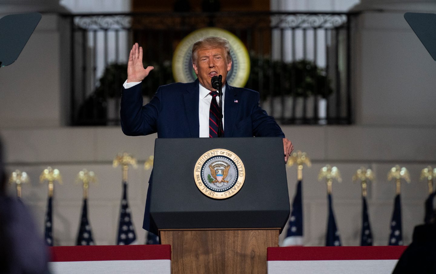 Trump speaks in front of the White House.