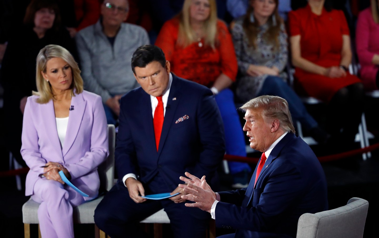 Donald Trump sitting next to two Fox News anchors.