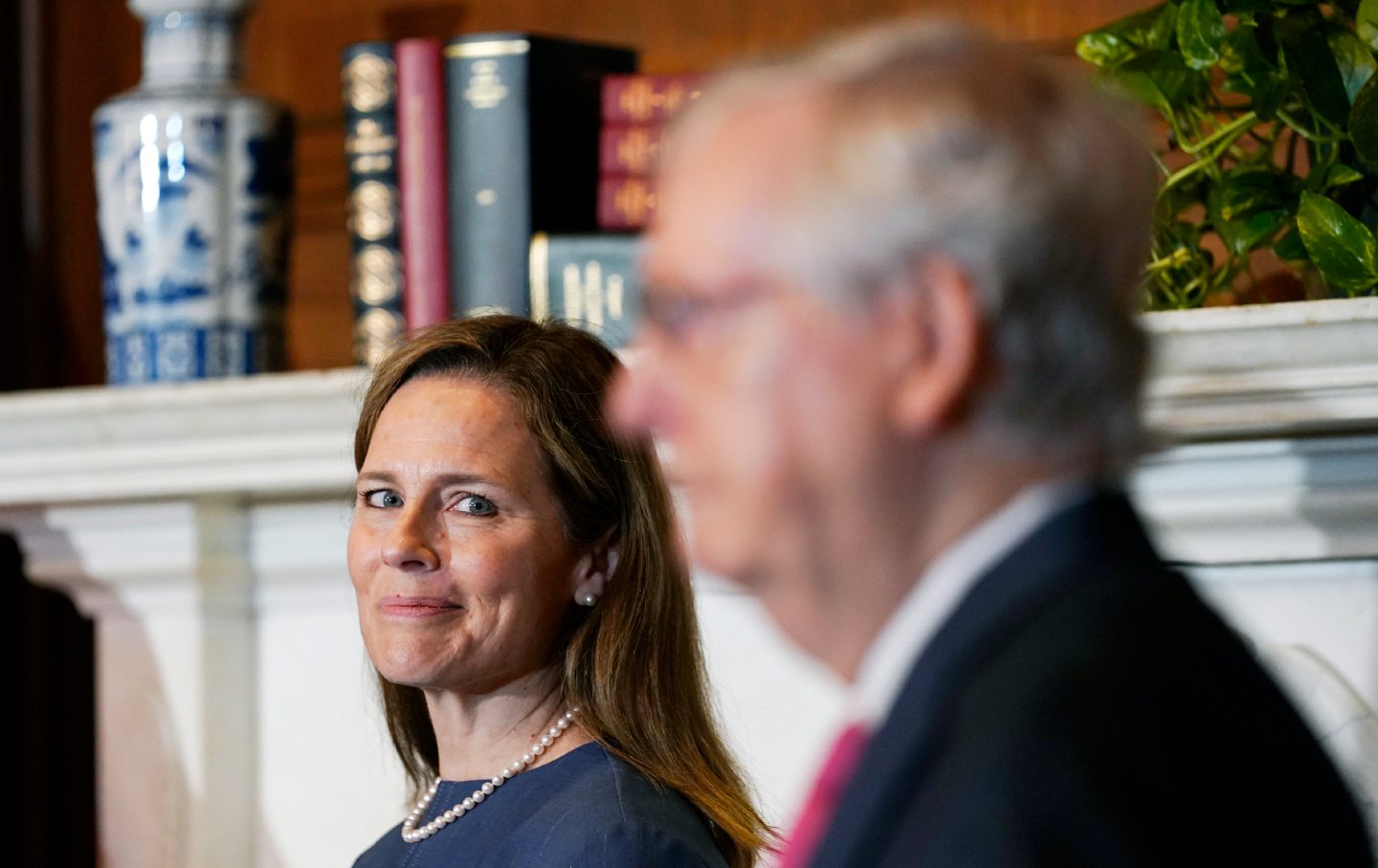 Amy Coney Barrett watches Mitch McConnell speak