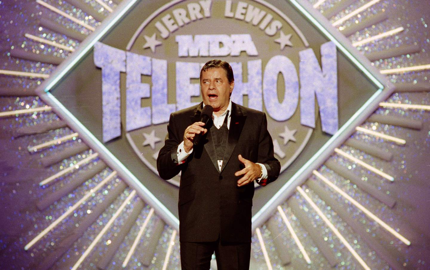 Jerry Lewis holding a microphone