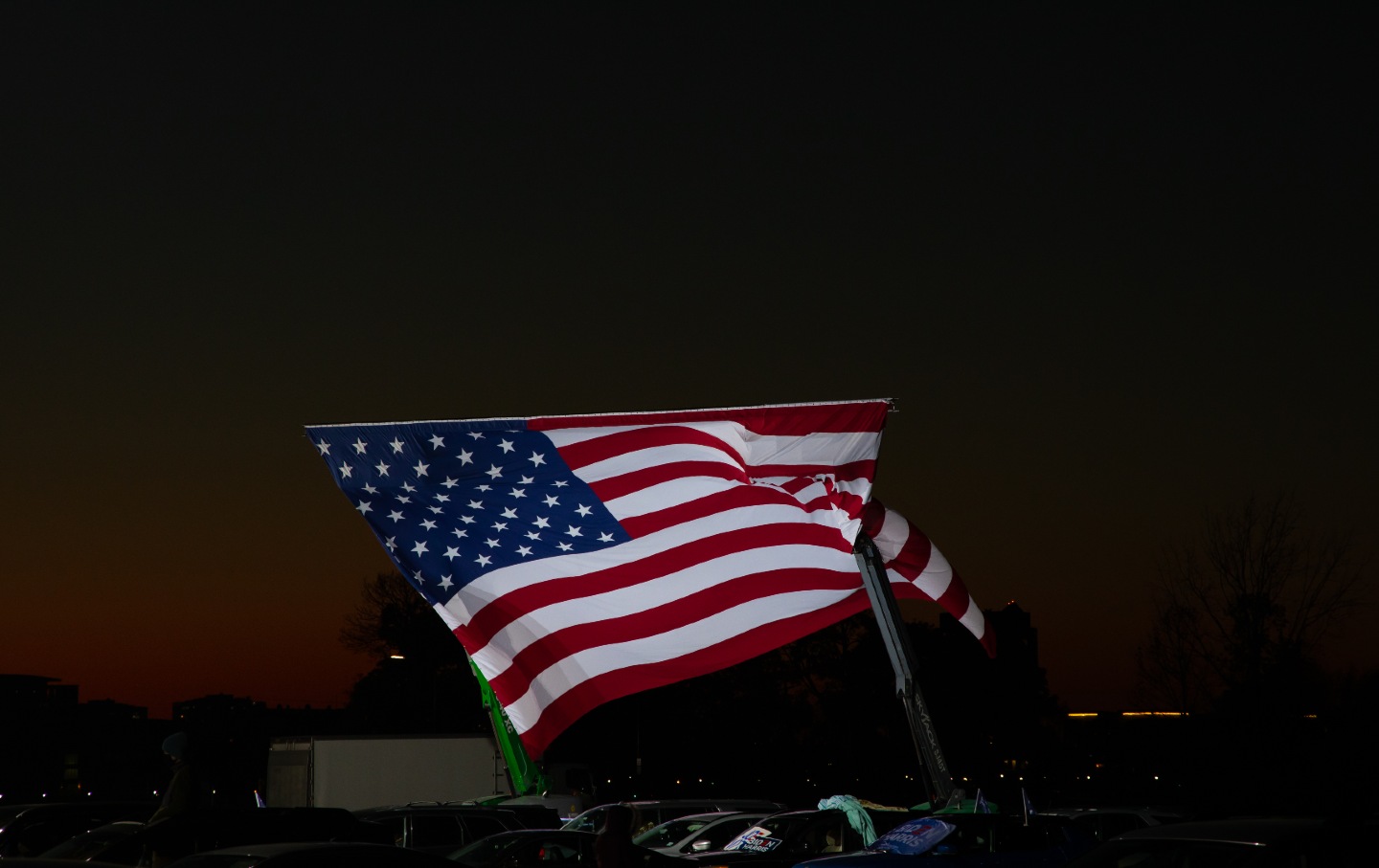 An American flag flies during a rally in support of Joe Biden's run for the US presidency on Belle Isle in Detroit.